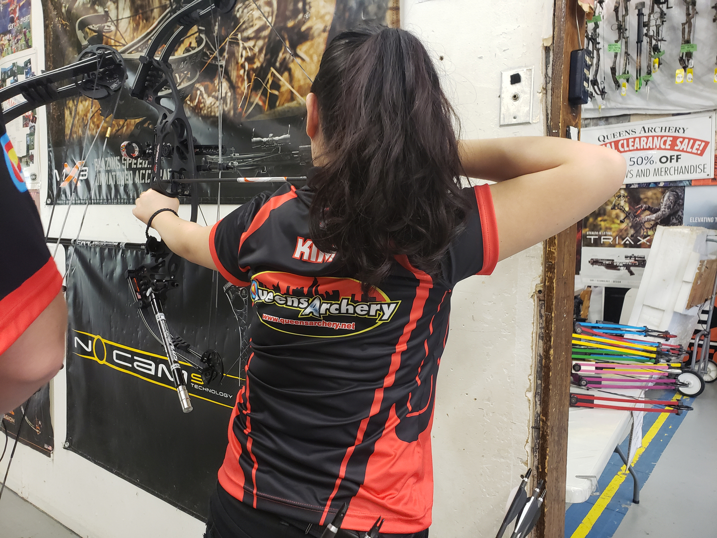 Female Archer Shooting a compound bow